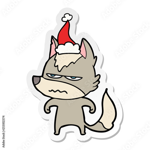 sticker cartoon of a annoyed wolf wearing santa hat