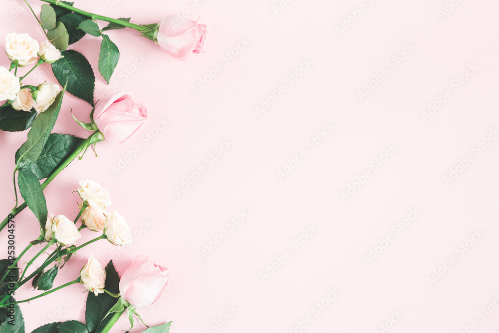 Flowers composition. Rose flowers on pastel pink background. Mothers day, womens day concept. Flat lay, top view, copy space
