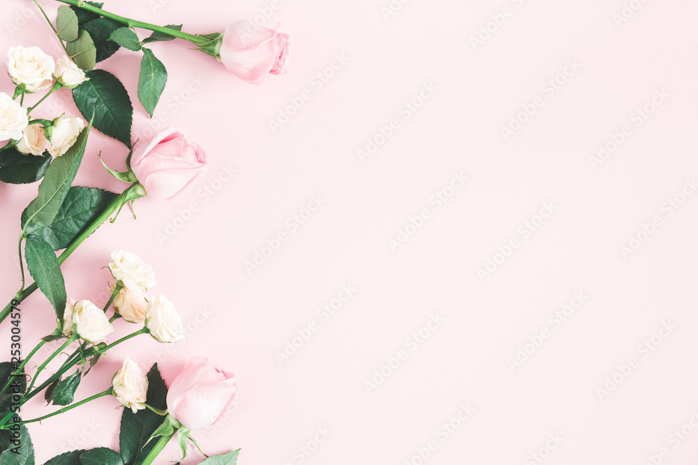 Naklejka premium Flowers composition. Rose flowers on pastel pink background. Mothers day, womens day concept. Flat lay, top view, copy space