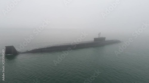 Nuclear above-water submarine in the open sea. photo