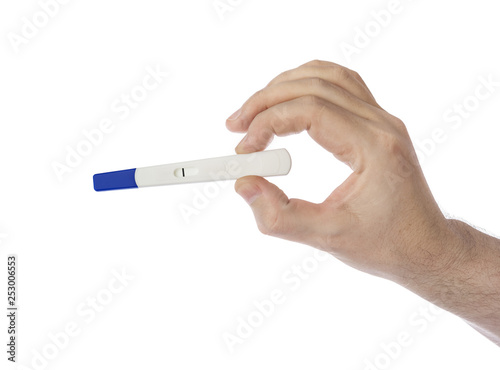 Hand with pregnancy test