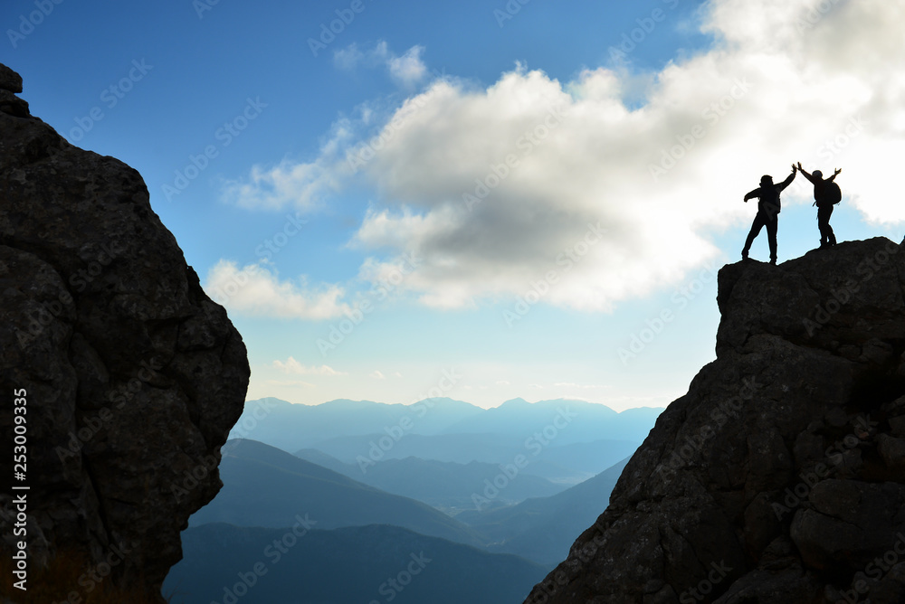 the happiness of success in the hills, cliffs and dangerous places