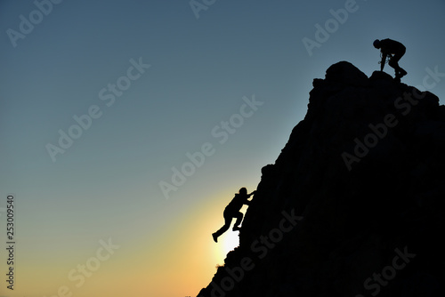 rock climbing striker and climber climbing without equipment