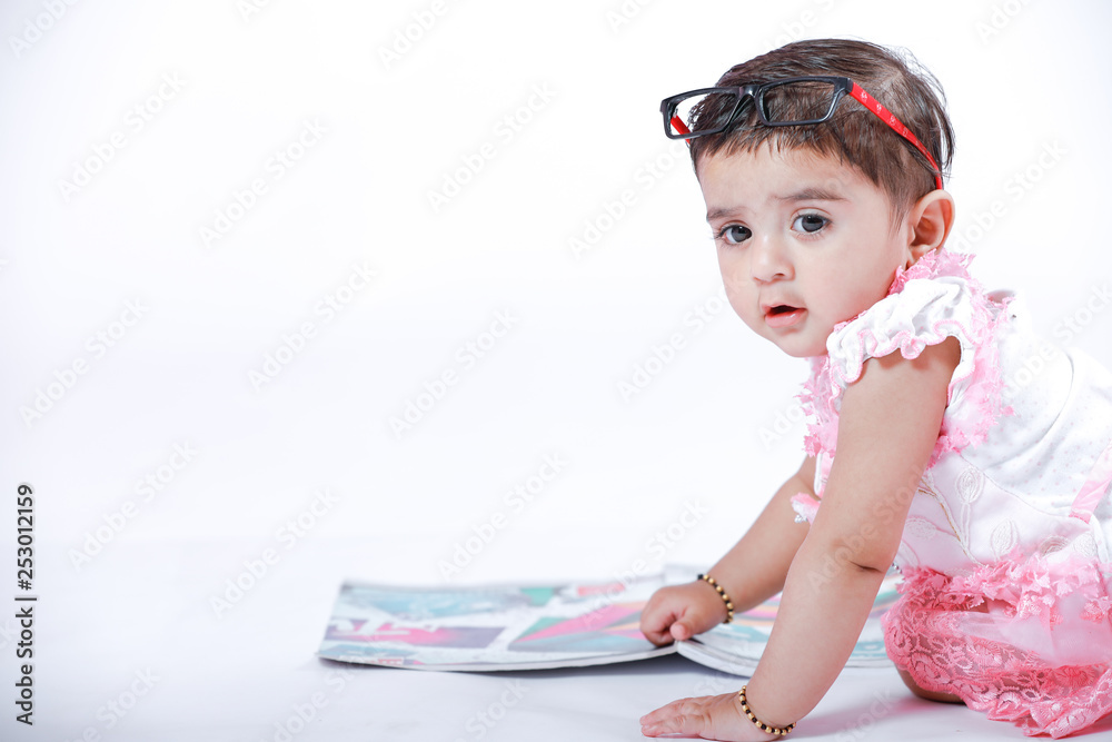 Indian Little Girl with note book , studying Indian Little Girl with note book , studying