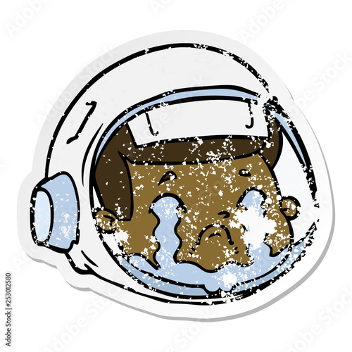 distressed sticker of a cartoon astronaut face crying