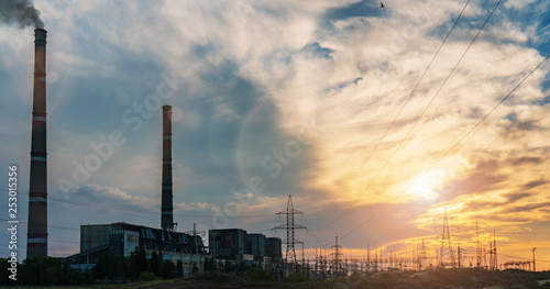 High voltage power lines in the winter. Thermal power plant. High-voltage transformer substation.