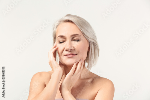 Mature woman giving herself...