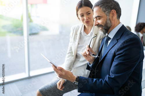 Businesspeople discussing together in conference room during meeting at office photo