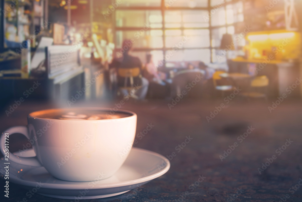 Cappuccino cup on the table with blur people in coffee shop background, vintage tone Cappuccino cup on the table with blur people in coffee shop background, vintage tone