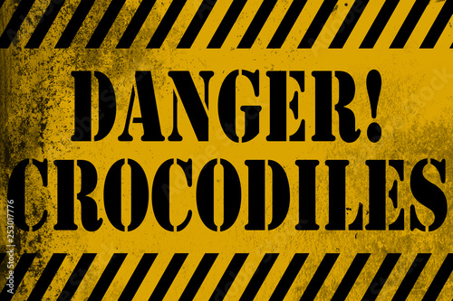 Danger crocodiles sign yellow with stripes