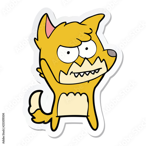 sticker of a cartoon grinning fox
