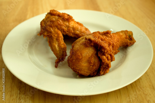 Chicken calves on the plate, background blurred