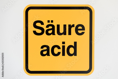 warning sign for acid in German and English