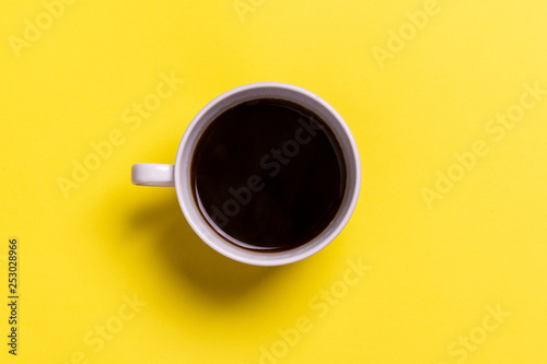 cup of coffee on a yellow background