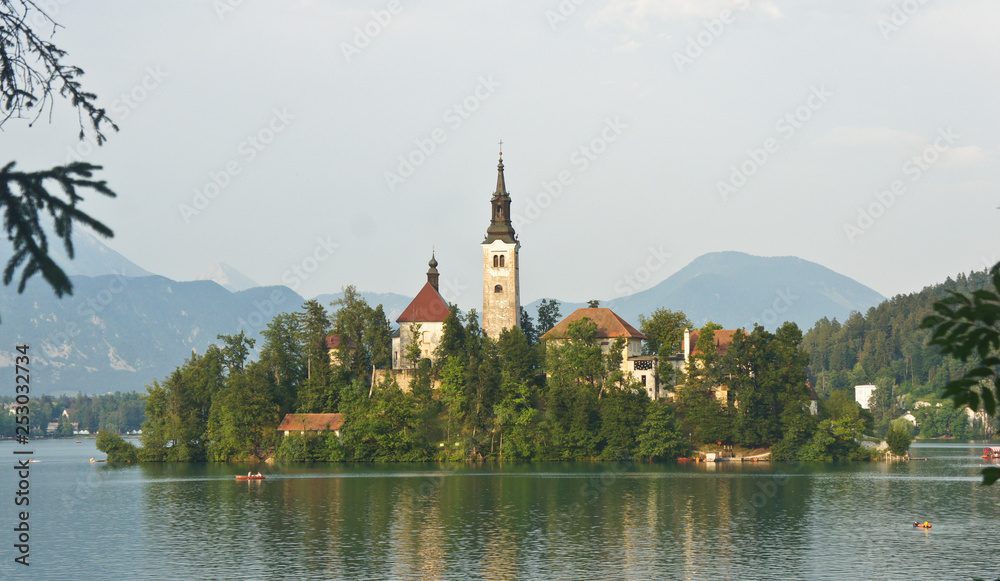 Beautiful view over Lake Bled, Julian Alps and church on the island, sunny day, Bled, Slovenia