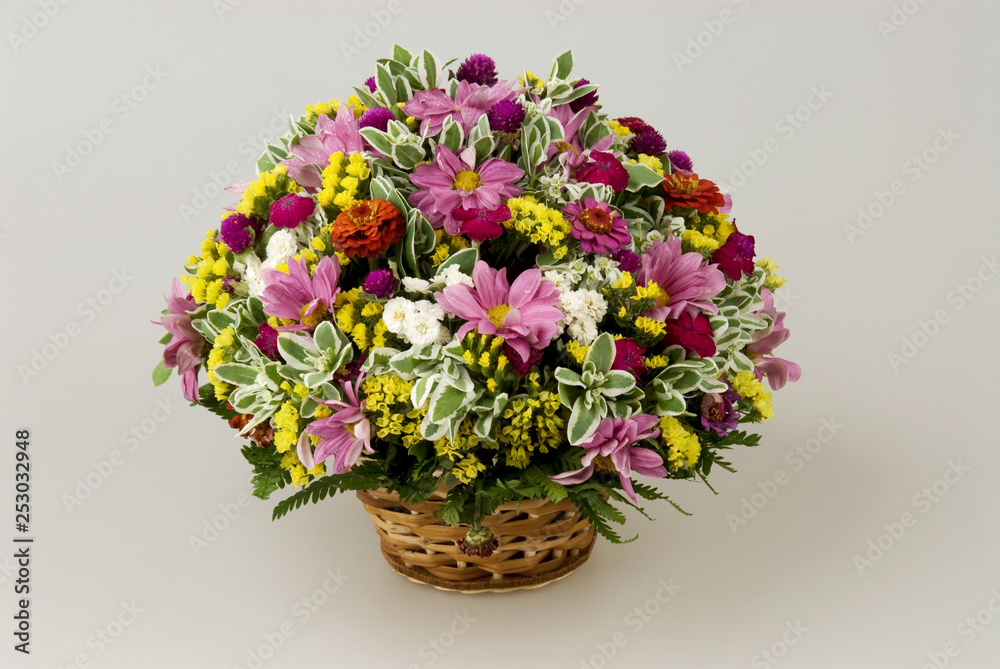 A bunch of flowers are different. Flowers in a basket