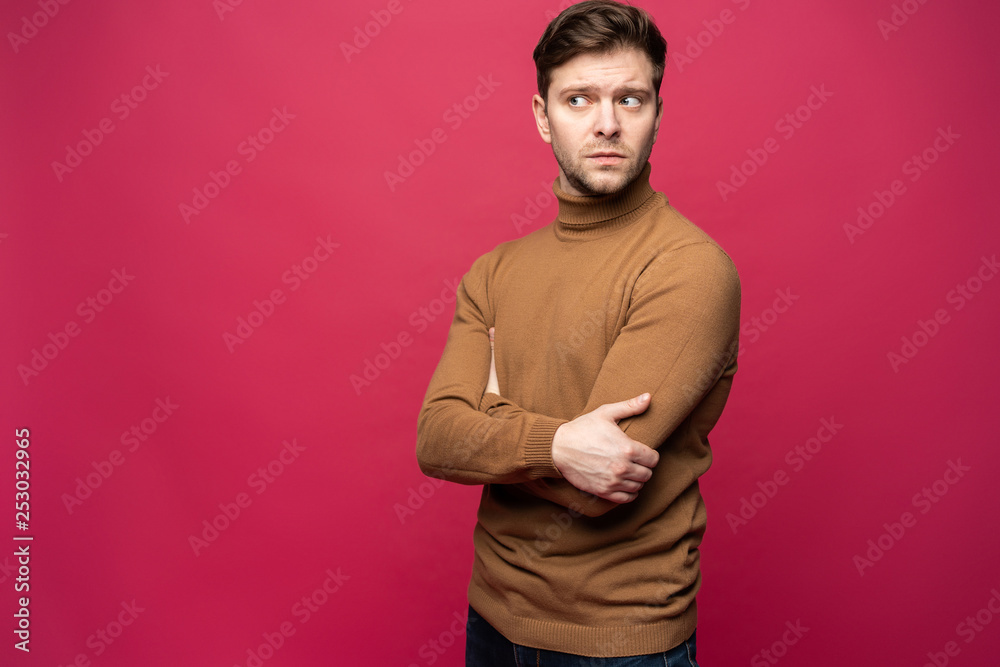 Portrait of a handsome young man smiling against pink background. Portrait of a handsome young man smiling against pink background.