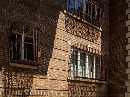 Windows with bars in a building of Williamsburg neighborhood in New York
