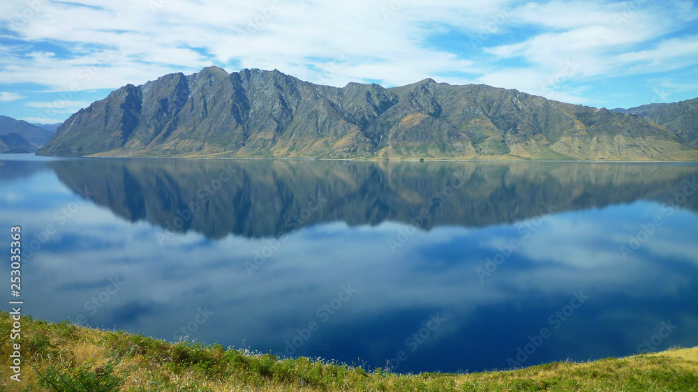 Mountain reflection on Lake Hawea in South island of New Zealand