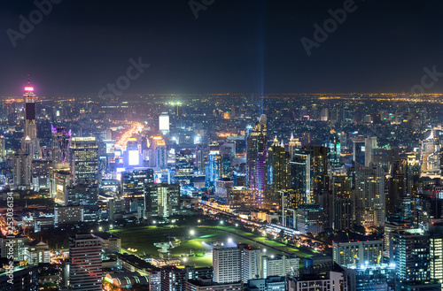 Cityscape with buildings crowded illumination with traffic light in Bangkok © Mumemories