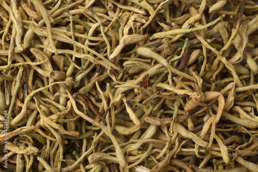 Dried honeysuckle flower tea (Jin Yin Hua), for backgrounds or textures Dried honeysuckle flower tea (Jin Yin Hua), for backgrounds or textures