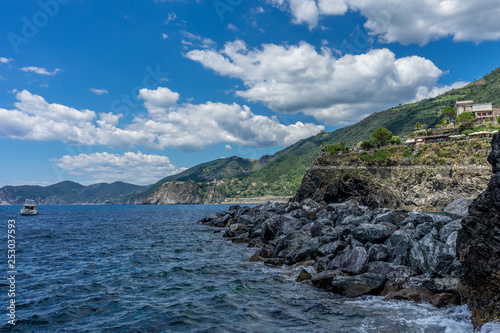 Italy, Cinque Terre, Manarola, a large body of water with a mountain in the background