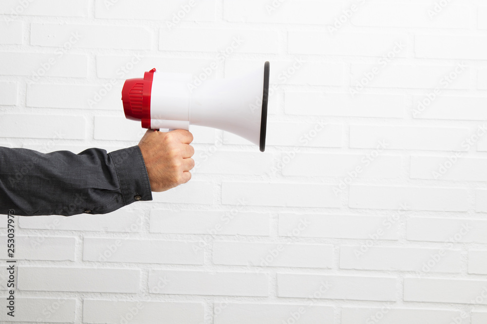 hand with isolated megaphone on white background Stock Photo | Adobe Stock