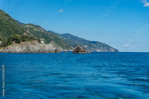 Fototapeta Naklejka Na Ścianę i Meble -  Italy, Cinque Terre, Monterosso, a body of water with a mountain in the background