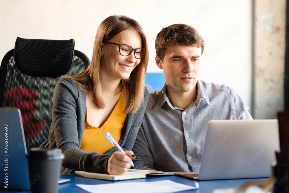 Man and woman work in a modern office. Project Discussion. Man and woman work in a modern office. Project Discussion.