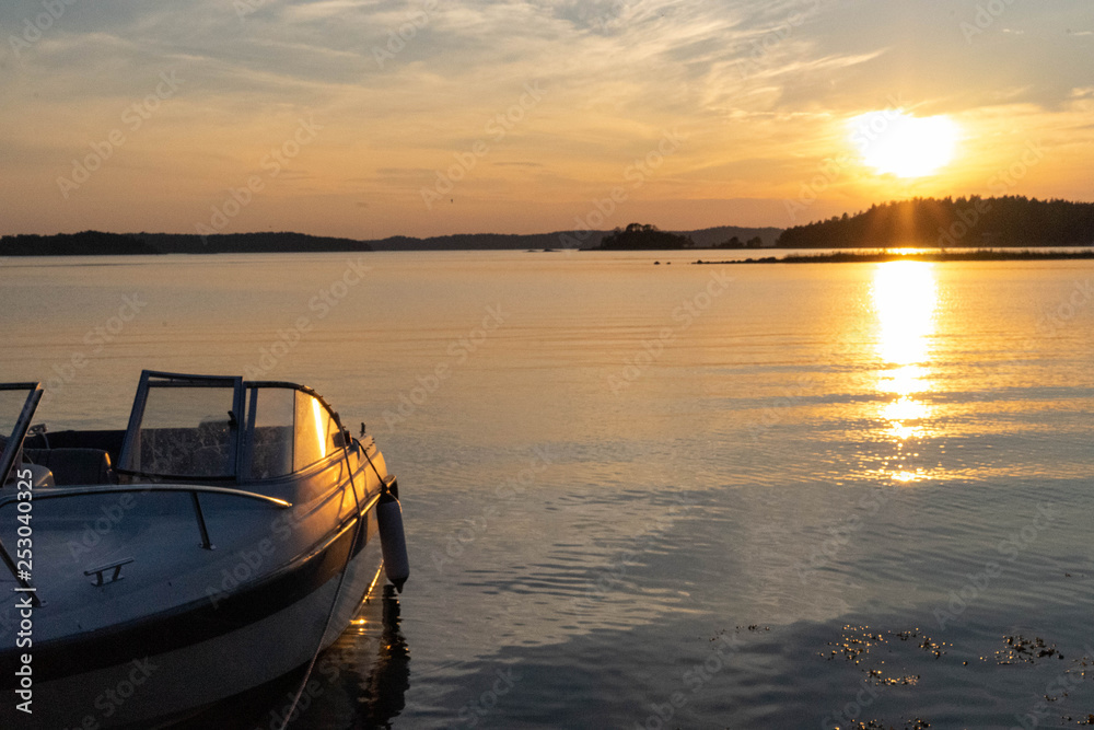 boat on lake at sunset