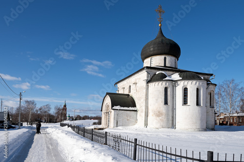 View of the white-stone Saint George Cathedral in Yuryev-Polsky in a sunny winter day, Russia