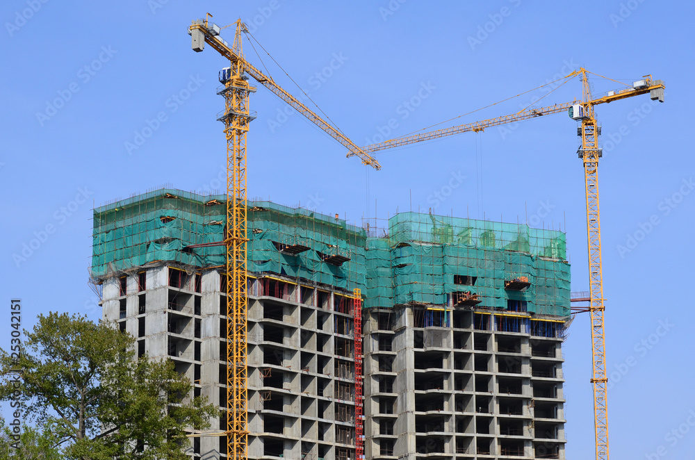 Two cranes at the construction site