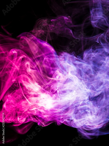 Colored smoke on black background © yauhenka