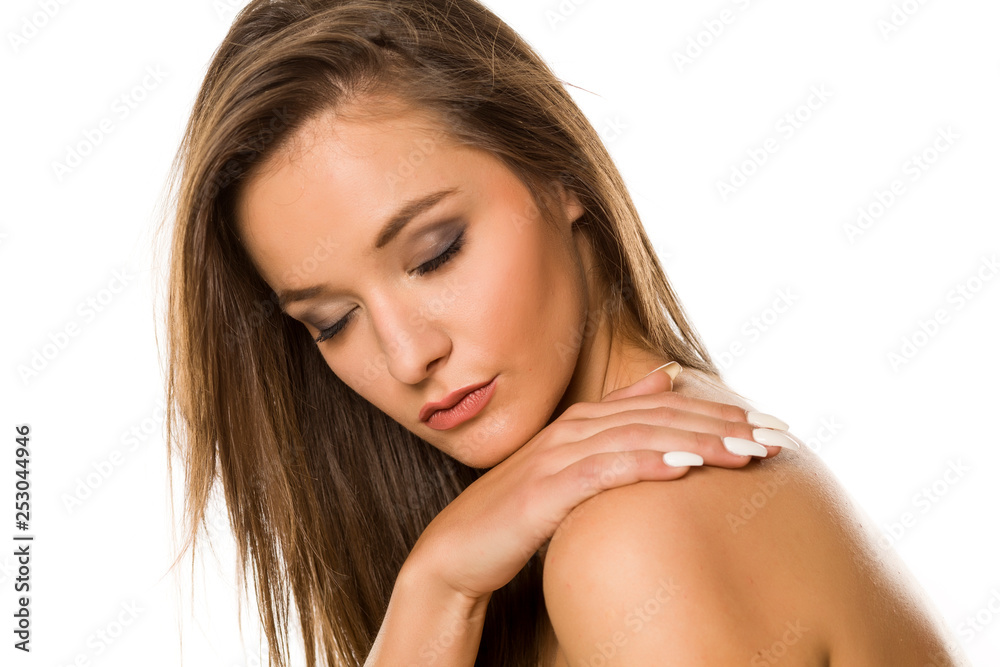 Portrait of young beautiful shirtless woman with makeup on white backgeound Portrait of young beautiful shirtless woman with makeup on white backgeound