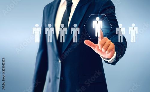 Businessman touching person virtual button about the concept of recruiting person and Personal development. photo