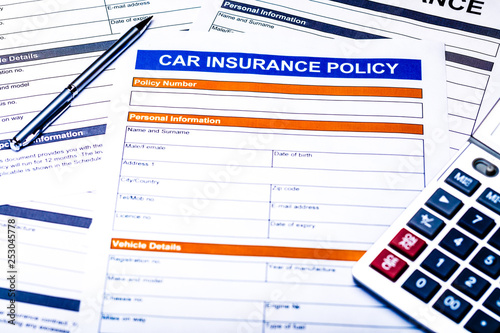 Car insurance policy. Document, pen, calculator on table. Business and insurance background concept.