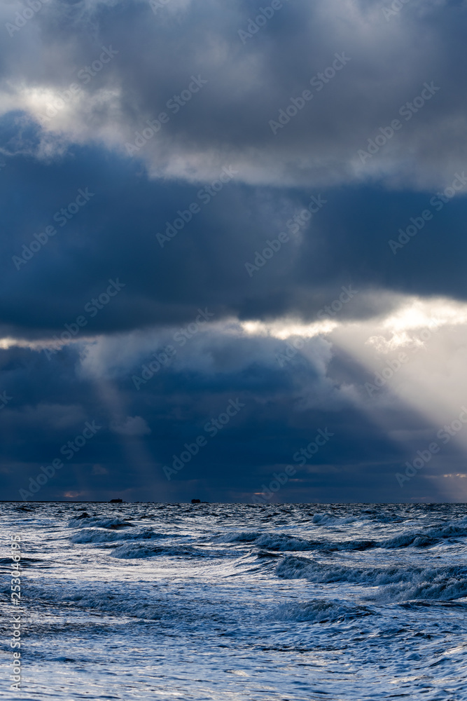 Stormy clouds above Baltic sea in winter time, Latvia coast.