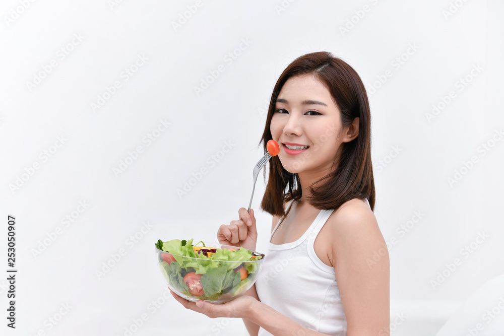 The concept of nutritional food. Beautiful girl takes care of her health by eating vegetables. Young athletes choose a good diet. The concept of nutritional food. Beautiful girl takes care of her health by eating vegetables. Young athletes choose a good diet.