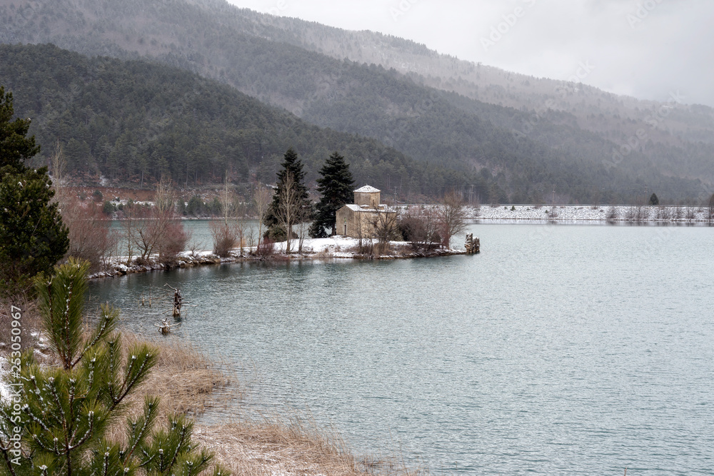 The ancient church of St. Fanur on the lake  Pineiou in winter (Greece, mountainous Corinthia)