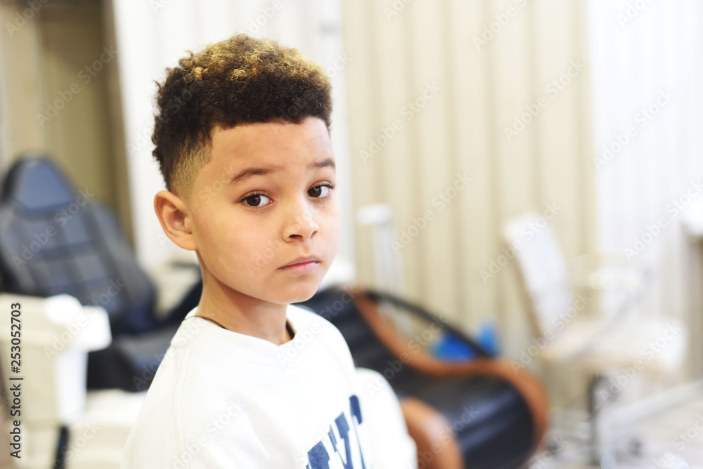 Cool stylish fashion mixed boy in hair salon studio. Fashion kids. Curly  hair african american boy close up portrait. Stock Photo | Adobe Stock