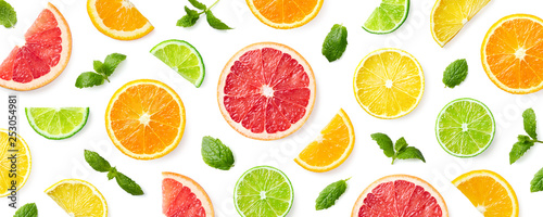 Leinwand Poster Colorful pattern of citrus fruit slices and mint leaves