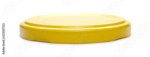Yellow jar lid isolated on white background