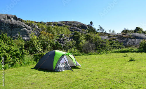 Camping in tent on grass