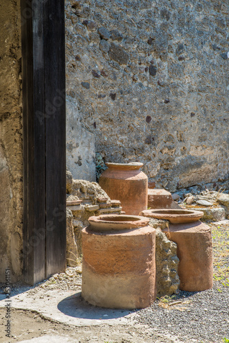 POMPEII, ITALY - 8 August 2015: Ruins of antique roman temple in Pompeii near volcano Vesuvius, Naples, Italy