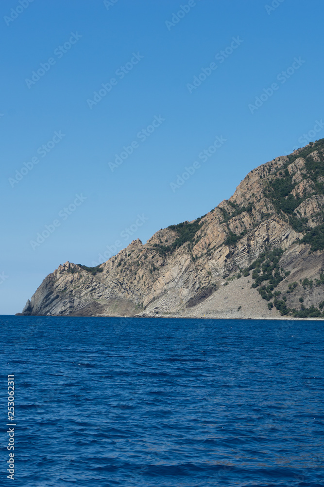 Italy, Cinque Terre, Monterosso, Monterosso al Mare, SCENIC VIEW OF SEA AND MOUNTAIN AGAINST CLEAR BLUE SKY