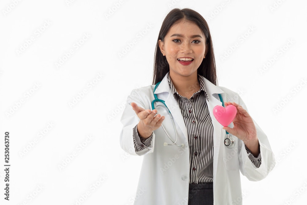 Portrait of smiling young Asian female doctor with stethoscope holding pink heart shape model on white background, healthcare and medical concept. Portrait of smiling young Asian female doctor with stethoscope holding pink heart shape model on white background, healthcare and medical concept.