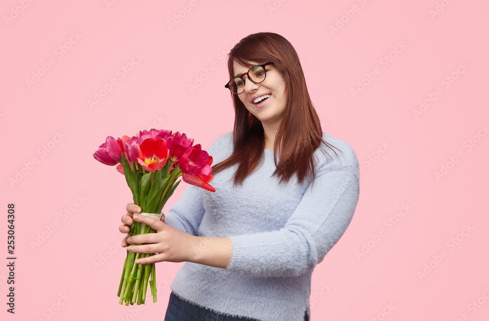 Happy woman with bouquet of tulips Happy woman with bouquet of tulips