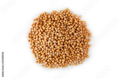 Organic yellow mustard seeds isolated on white background