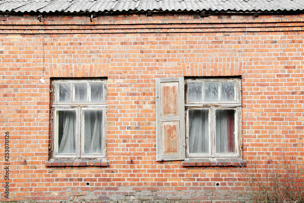 old window on brick wall