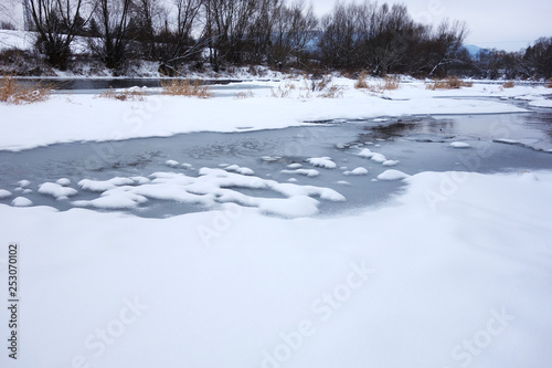 Snowy river in winter nature
